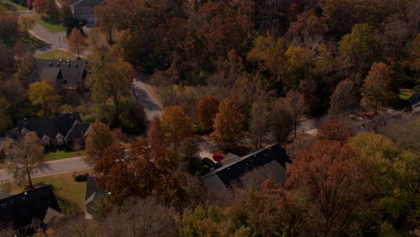 Slow-push-over-houses-and-beautiful-trees-in-Autumn-in-St