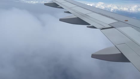 aircraft flying above clouds