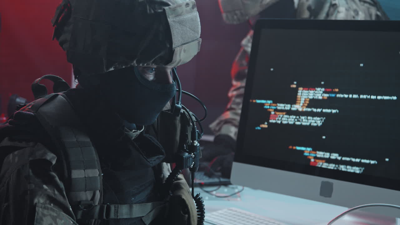 Special Forces Officer Checking Hackers Computer