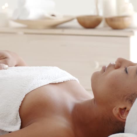 young female relaxing in spa salon