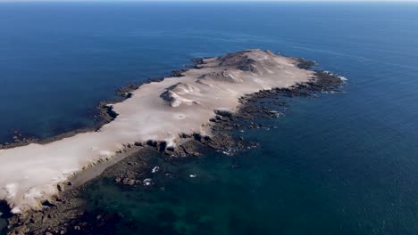 aerial orbit around isla la asuncion desert rocky island on mexico coast