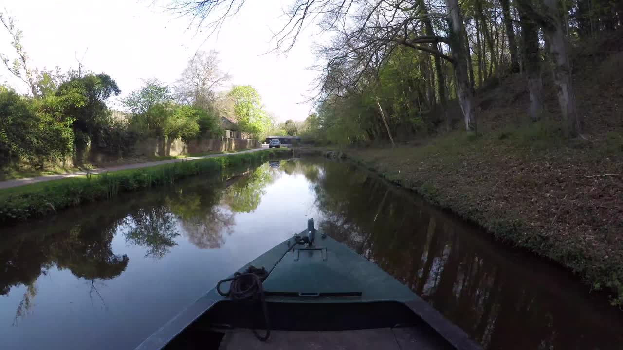Barge Narrowboat Timelapse. Lovely reflection of the trees in the water on the Kennet and Avon Canal