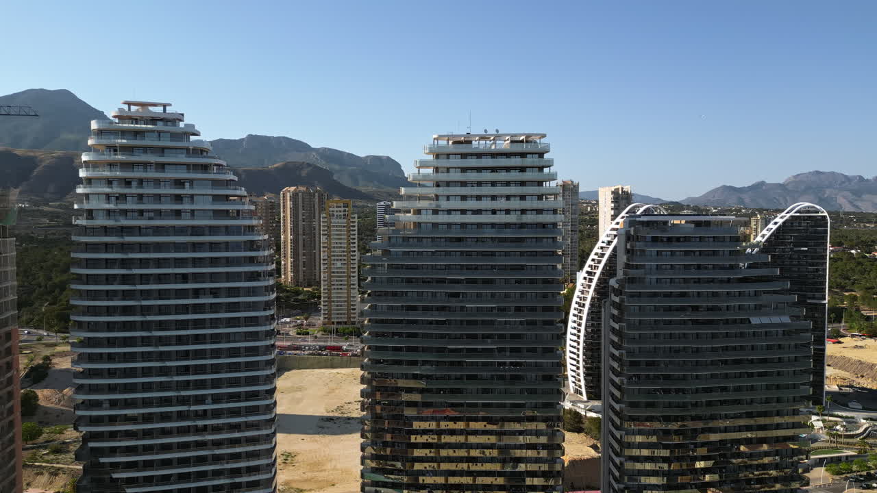 Aerial drone view of the buildings along the coastline in Benidorm, Spain in daylight