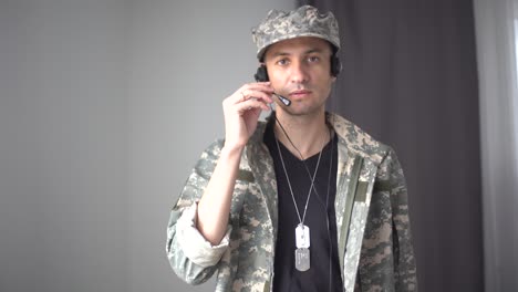 serious responsible young guy looking at camera listening order with confidence, discipline. indoor studio shot