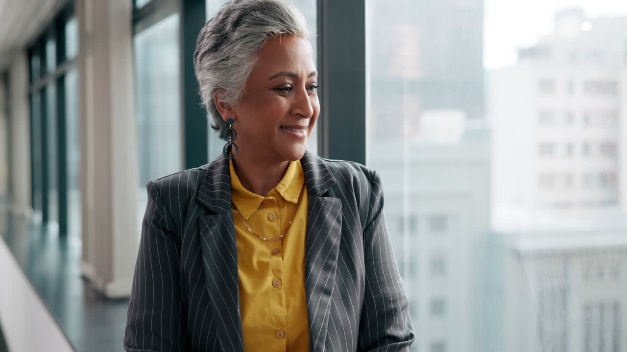 Professional businesswoman looking out of office window
