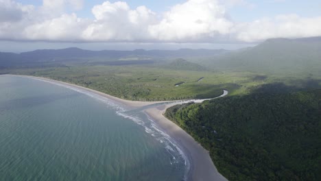 Daintree-National-Park-River-Flowing-Through-The-Ocean-In-Far-North-Queensland,-Australia---aerial-drone-shot