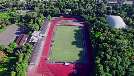 aerial drone of a small stadium, camera down