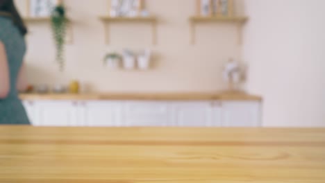 loaves of homemade bread on table and girl in kitchen