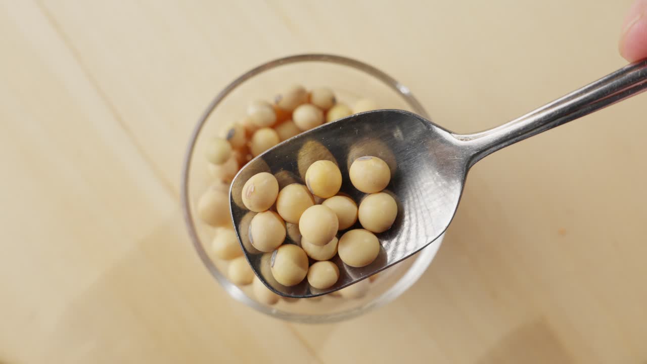 Slow motion shot of soybeans gracefully falling