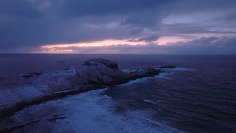the ocean cliffs in ervik on the west coat of norway during sunset in winter