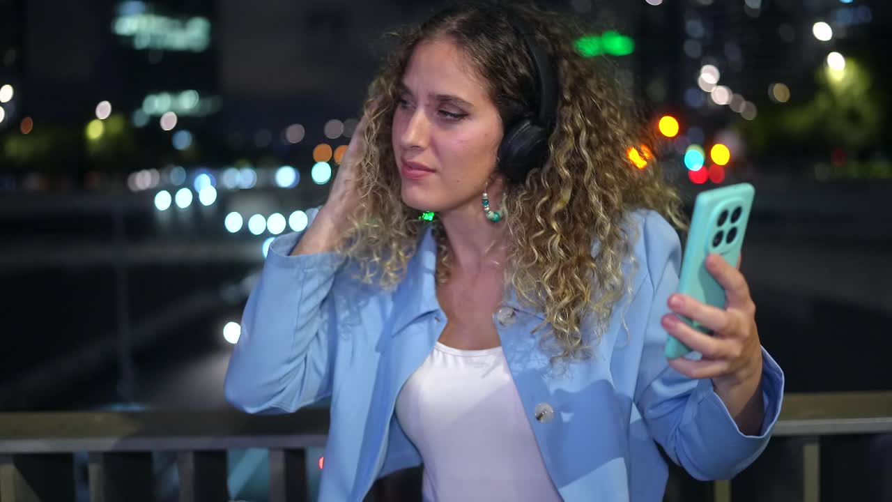 Woman Listening to Music with Headphones at Night