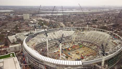 tottenham stadium in building process with cranes around drone shot