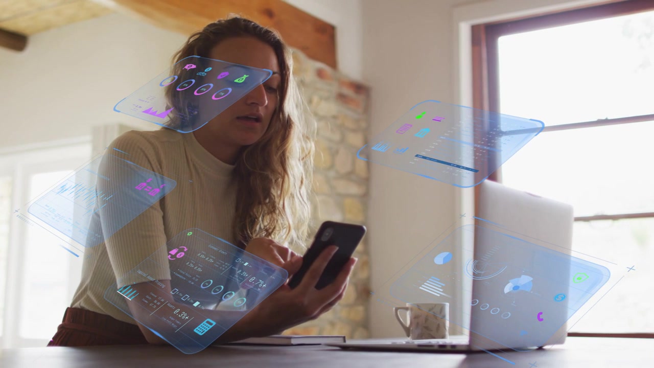 Woman tapping smartphone, summoning holographic panels floating over laptop for remote work