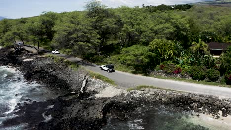 jeep driving around hawaii on a road true