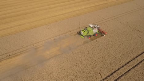 harvest half pivot tracking shot claas combine harvester in field