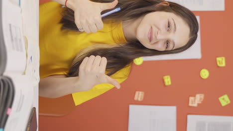 vertical video of happy and satisfied girl child looks at camera with positive gesture expression.