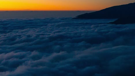 sea of clouds at sunset in la palma island, canary islands