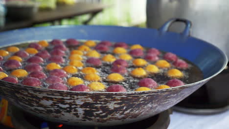 Fried-food-on-an-asian-street-food-market-filmed-in-slowmotion