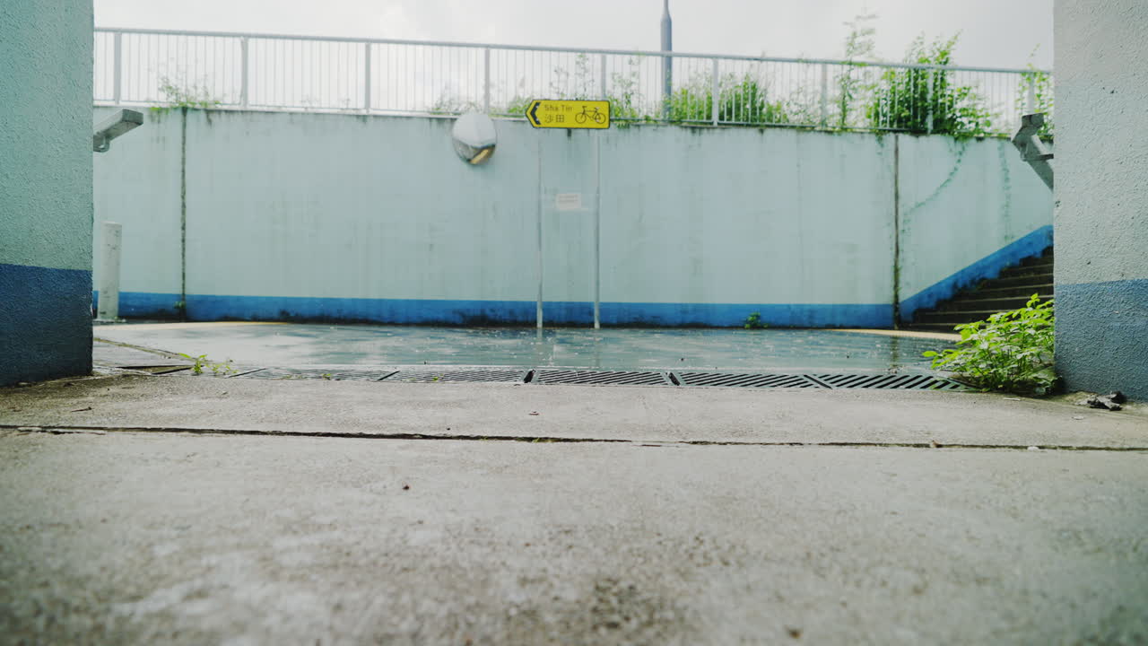 Tarmac grungy road at HongKong apartment during rains