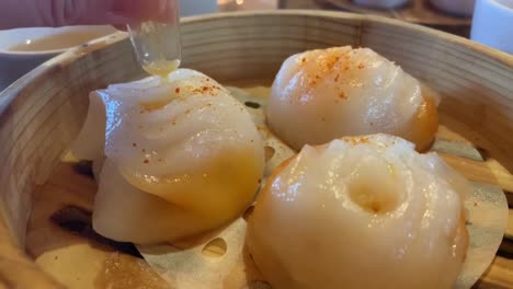 lobster and shrimp ha gow with butter sauce injection at a chinese dimsum restaurant