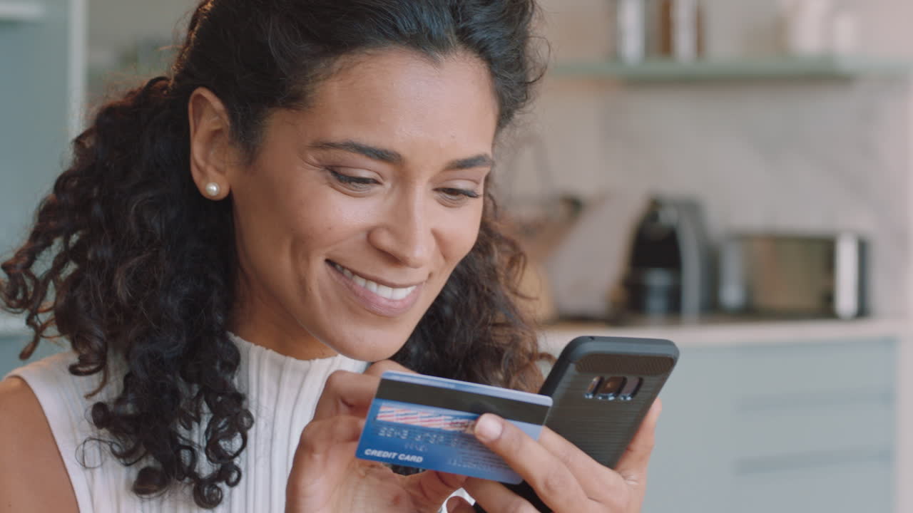 beautiful woman using smartphone shopping online spending money on credit card mobile banking app with digital currency enjoying financial freedom