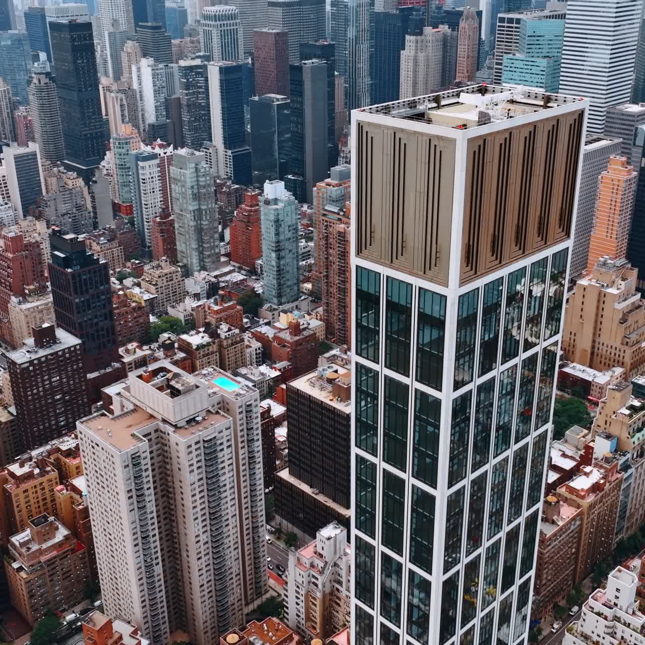 Sutton Tower building in the architecture of New York. Top view on the luxurious skyscraper at the backdrop of cityscape
