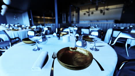 empty restaurant tables set for dinner