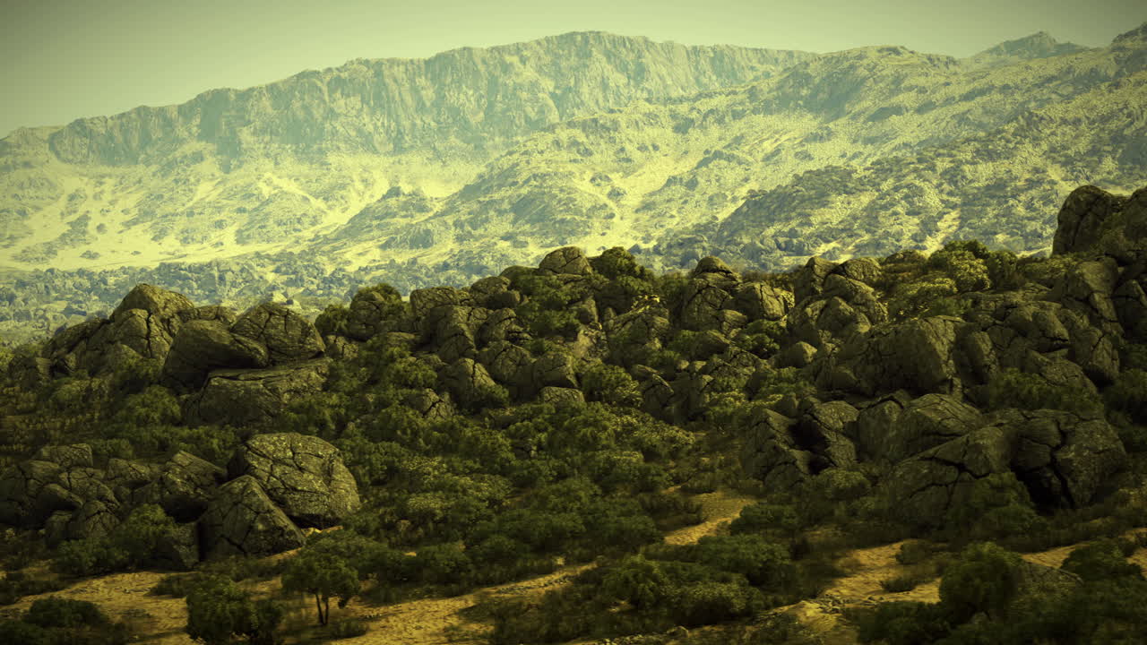 Majestic mountain range with rocky outcrops in golden sunlight