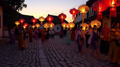 nighttime festival parade with lanterns