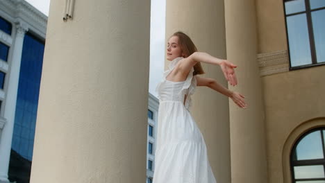 young woman in white dress posing outdoors