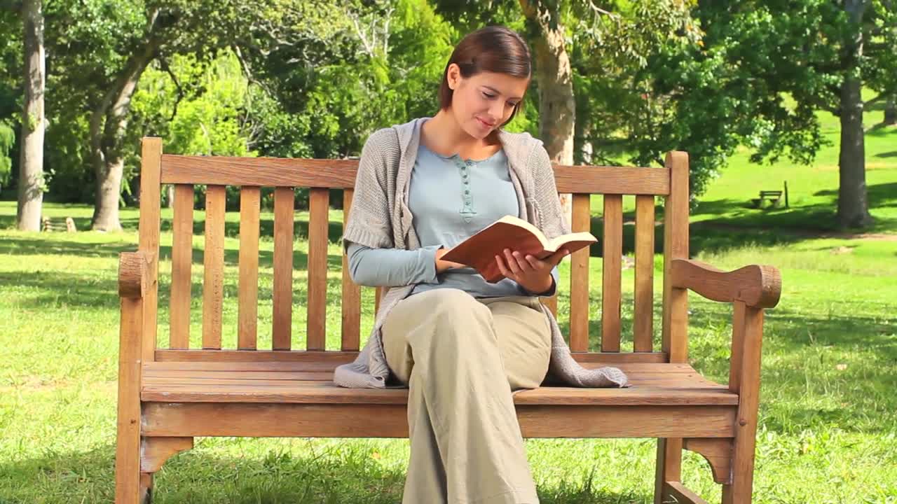 Young woman reading a book