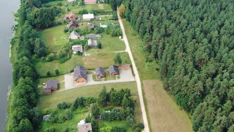 luxury private homes built on nemunas river bank, aerial drone view