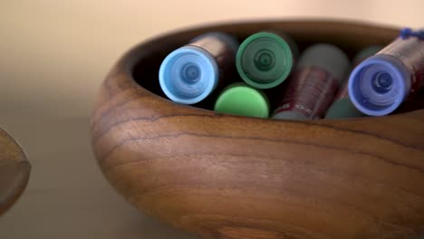 Oil-pastels-and-glue-sticks-in-wooden-bowls