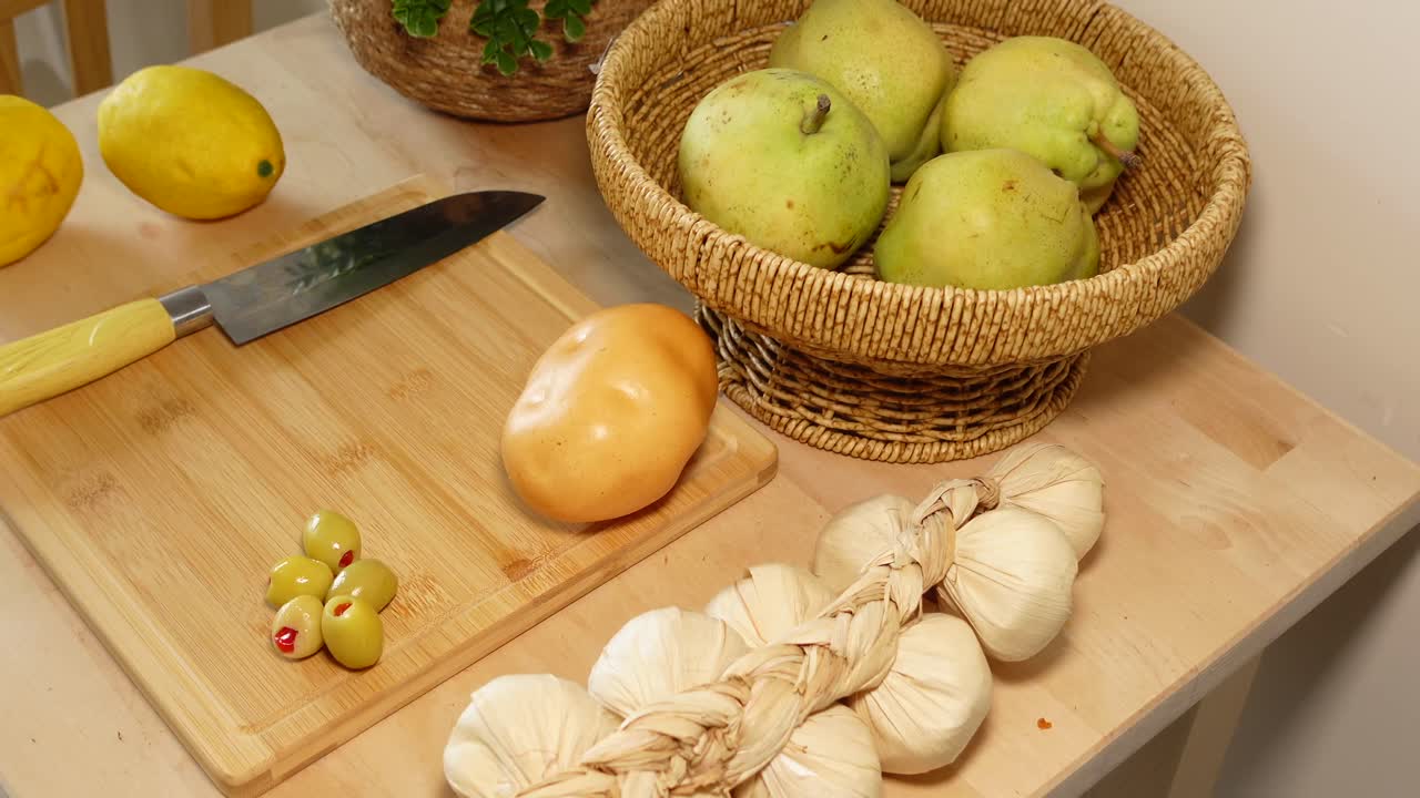 Still life with lemons, pears, and garlic