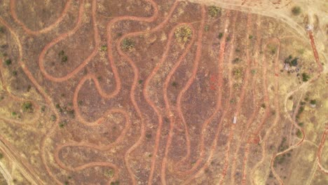 Mountain bike circuit. Descending aerial view. Mountain bike racing circuit layout seen from the air. Curves and mountain bike competition circuit route. MTB circuit. Granada. Spain.