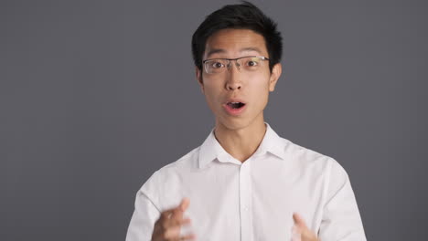 Surprised-Asian-man-in-front-of-the-camera.