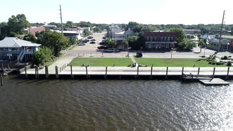 Apalachicola-City-Dock-and-Water-Street-in-Apalachicola,-Florida-are-seen-from-the-Apalachacola-River