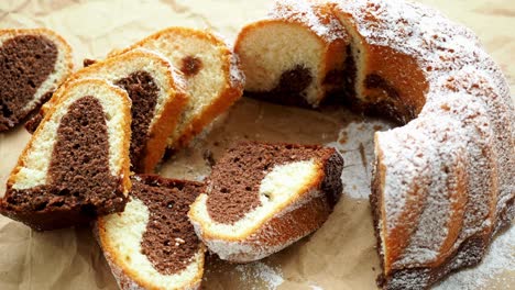 traditional homemade marble cake. sliced marble bundt cake on paper.