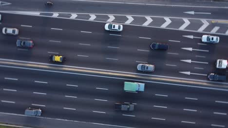 Circular-rotation-view-of-cars-and-trucks-driving-on-General-Paz-motorway-in-Buenos-Aires,-Argentina