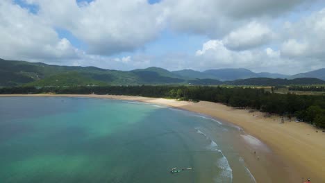 Tropical-Sandy-Beach-on-Hainan-Island,-Sanya,-China---Static-Aerial-Landscape