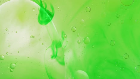 animation of bubbles moving on green background with copy space