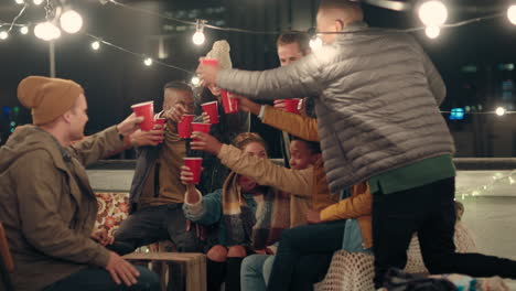 happy-group-of-friends-enjoying-rooftop-party-celebration-drinking-making-toast-having-fun-social-gathering-celebrating-weekend-of-friendship-at-night