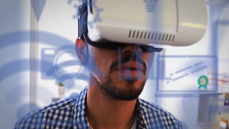 Mehrere-Blaue-Digitale-Symbole-Vor-Einem-Mann,-Der-Im-Büro-Ein-VR-Headset-Trägt