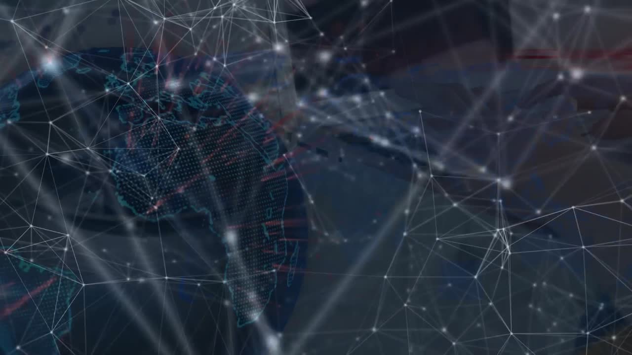 Animation of globe with network of connections with glowing spots over computer