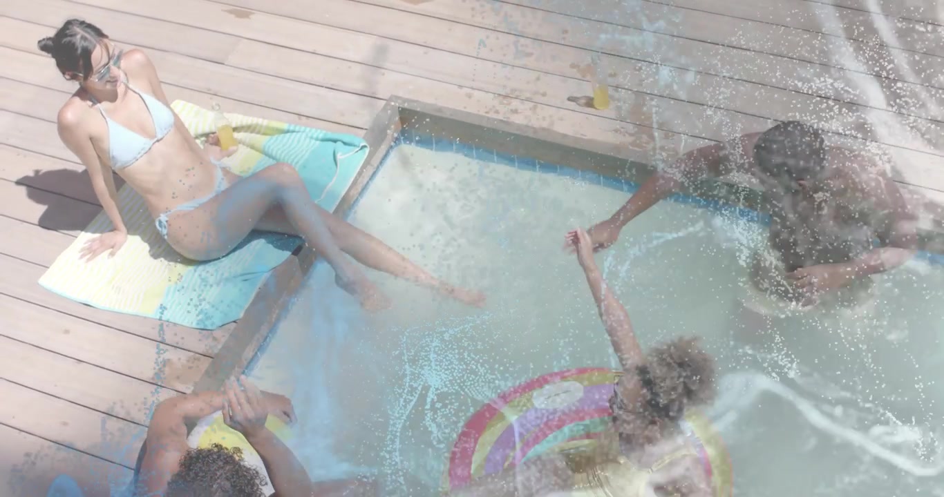 man scooping pool water initiating animated ripple overlay while friends splashing for summer ad