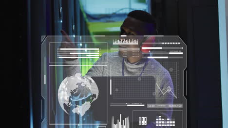 animation of data processing and diagrams over biracial male worker using laptop in server room