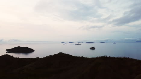 drone nadi fiji malalo island scenic landscape scattered islands cloudy beautiful peaceful relaxing island mountain hike honeymoon adventure resort aerial cinematic forward upward movement