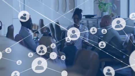animation of network of connections with icons over diverse business people in office