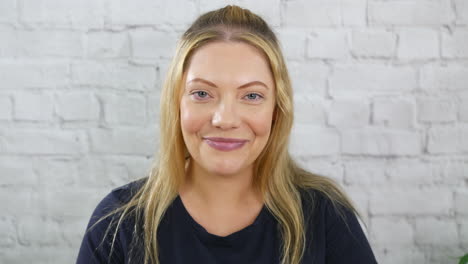 Portrait-of-an-attractive-happy-blonde-woman-smiling