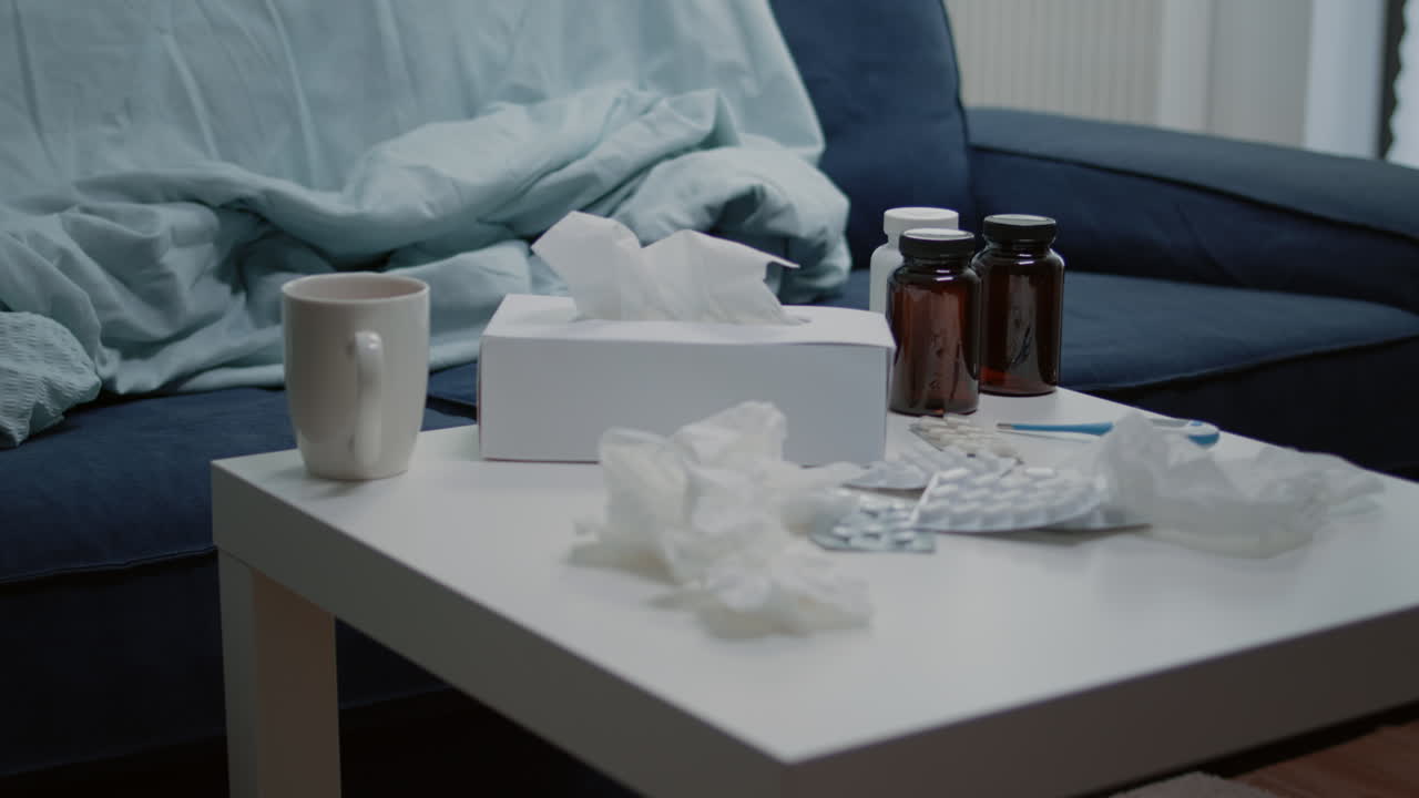 Close up of coffee table with medicine and bottle of pills